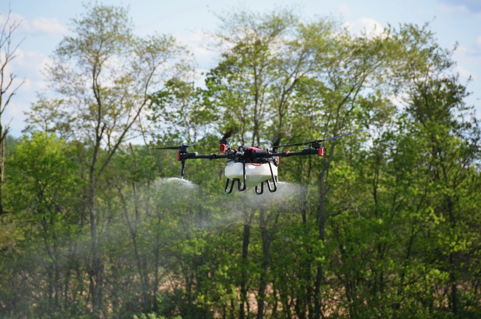 Aerial drone in flight over open countryside